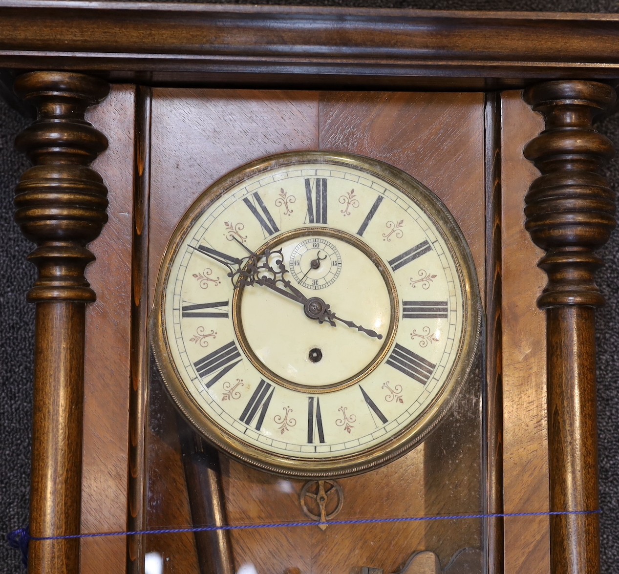 Two late 19th / early 20th century Vienna type wall clocks, larger 119 cms and a set of oak cased scientific beam scales.